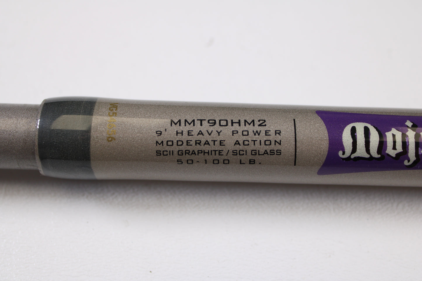 Close-up of a St. Croix Mojo Musky Trolling MMT90HM2 9'0" Heavy casting rod in mint condition, showing printed specs—ideal for those interested in our Rod and Reel Trade-In Program.