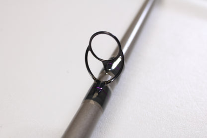 Close-up of the St. Croix Mojo Musky Trolling MMT80HM 8'0" Heavy—Used Casting Rod in mint condition, focusing on the metal guide and support. Great for those upgrading gear with our Rod and Reel Trade-In Program for store credit.