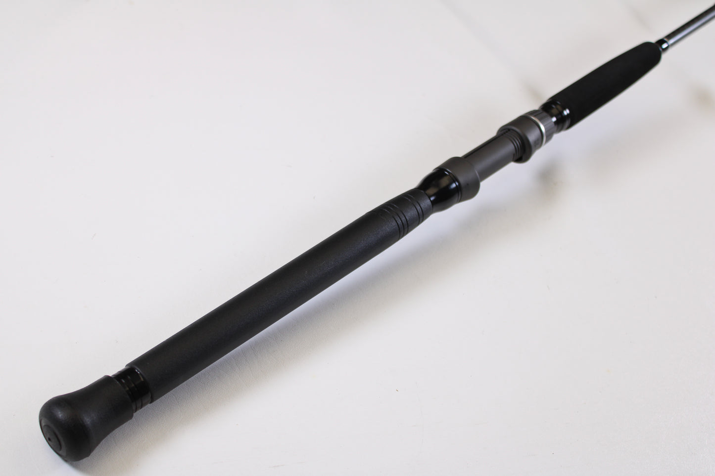 Close-up of a Shimano Terez BW TZBWS72MSBA 7'2" Medium Used Casting Rod in mint condition, featuring a black cushioned handle—ideal for anglers looking to trade in gear for store credit.