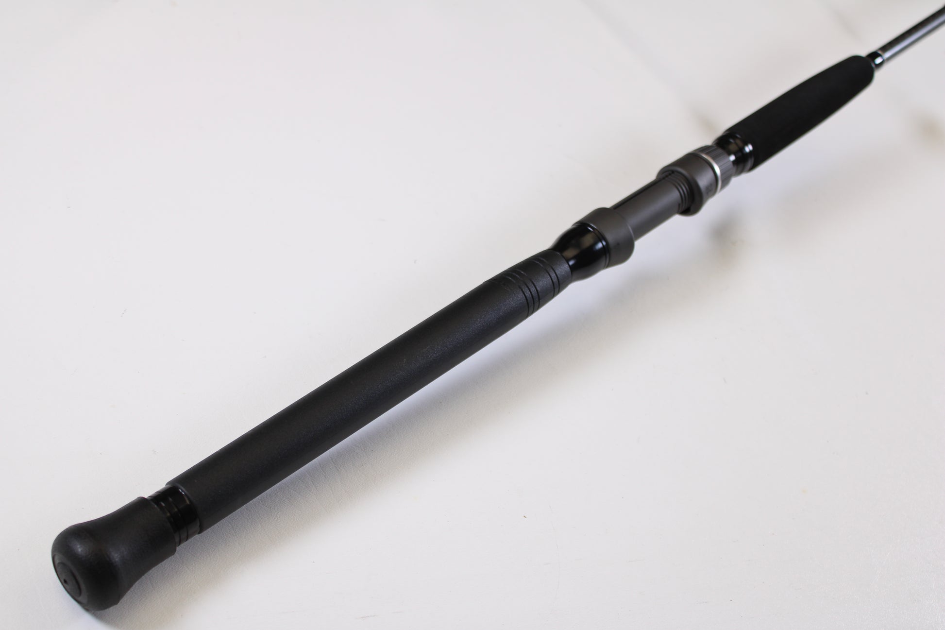 Close-up of a Shimano Terez BW TZBWS72MSBA 7'2" Medium Used Casting Rod in mint condition, featuring a black cushioned handle—ideal for anglers looking to trade in gear for store credit.