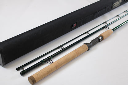 A St. Croix Tidemaster Travel TIC76MHF3 7'6" Medium Heavy 3-piece used casting rod in excellent condition, featuring a cork handle and black case, is shown—ideal for the Rod and Reel Trade-In Program.