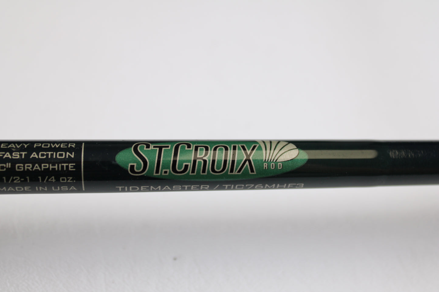 A close-up of a St. Croix Tidemaster Travel TIC76MHF3 7'6" Medium Heavy 3 Piece Used Casting Rod in excellent condition—ideal for those interested in used gear or our Rod and Reel Trade-In Program for store credit.