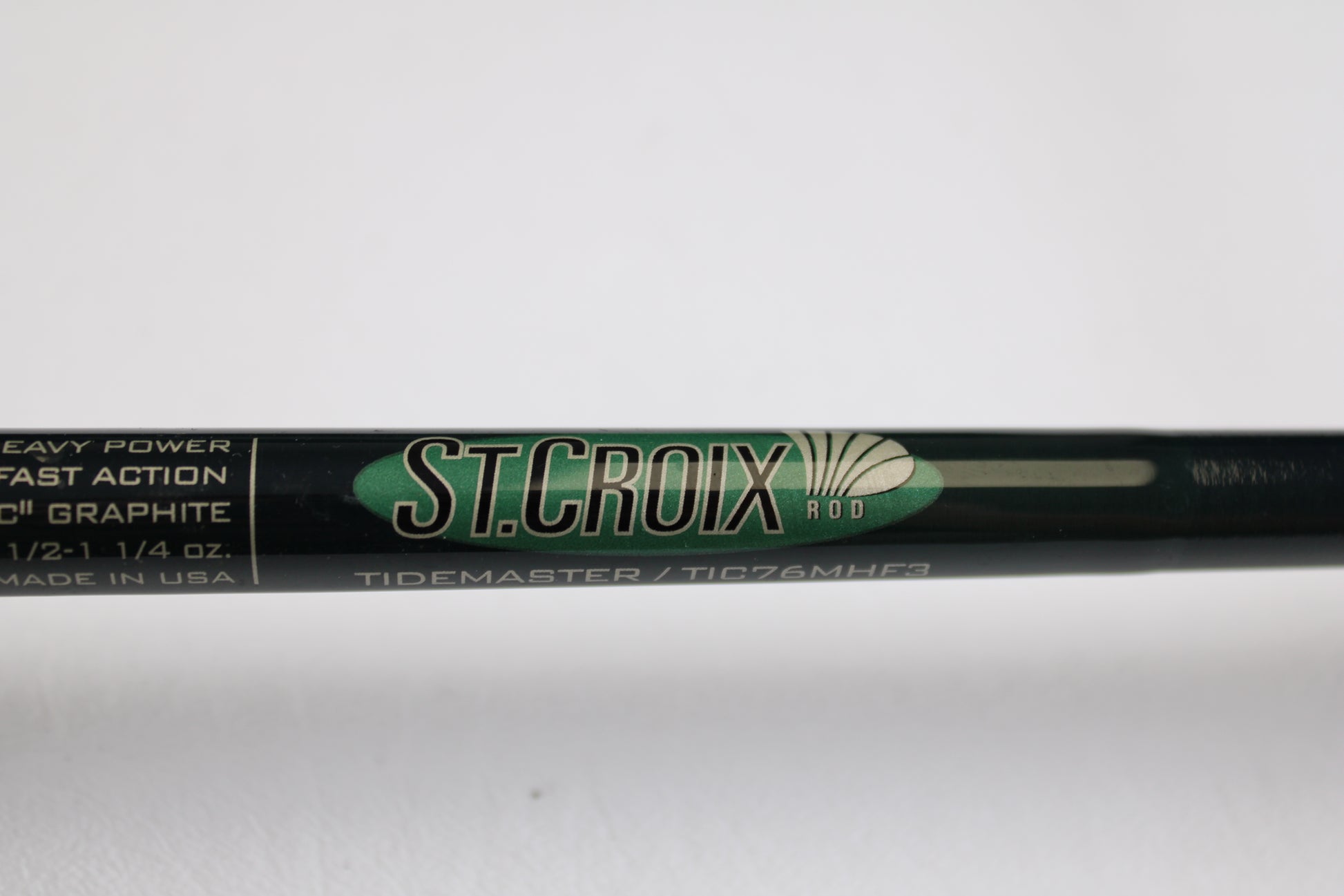 A close-up of a St. Croix Tidemaster Travel TIC76MHF3 7'6" Medium Heavy 3 Piece Used Casting Rod in excellent condition—ideal for those interested in used gear or our Rod and Reel Trade-In Program for store credit.