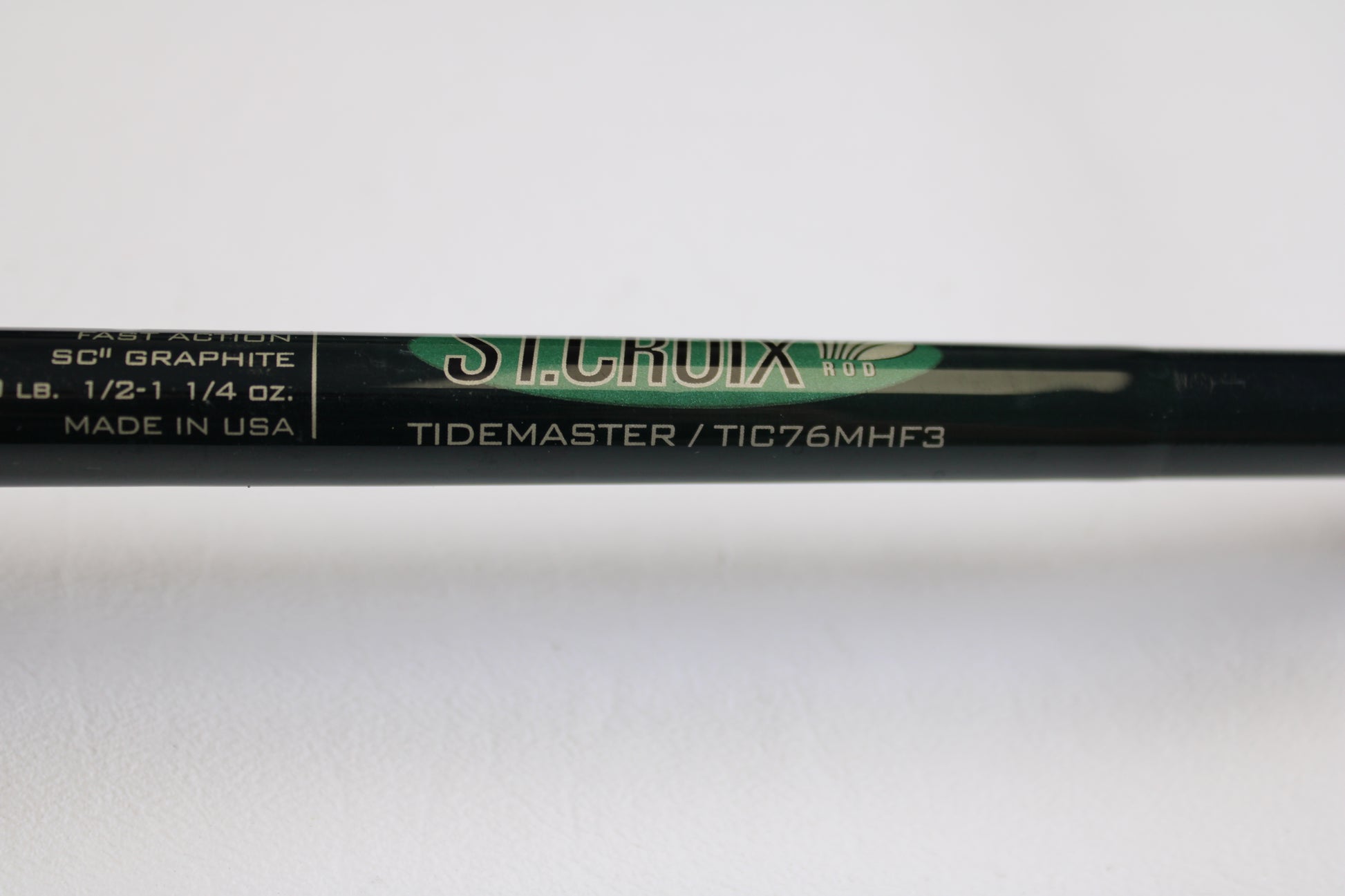 A close-up of a St. Croix Tidemaster Travel TIC76MHF3 7'6" Medium Heavy 3-piece used casting rod in excellent condition—ideal for upgrading through our Rod and Reel Trade-In Program or earning store credit on quality used gear.