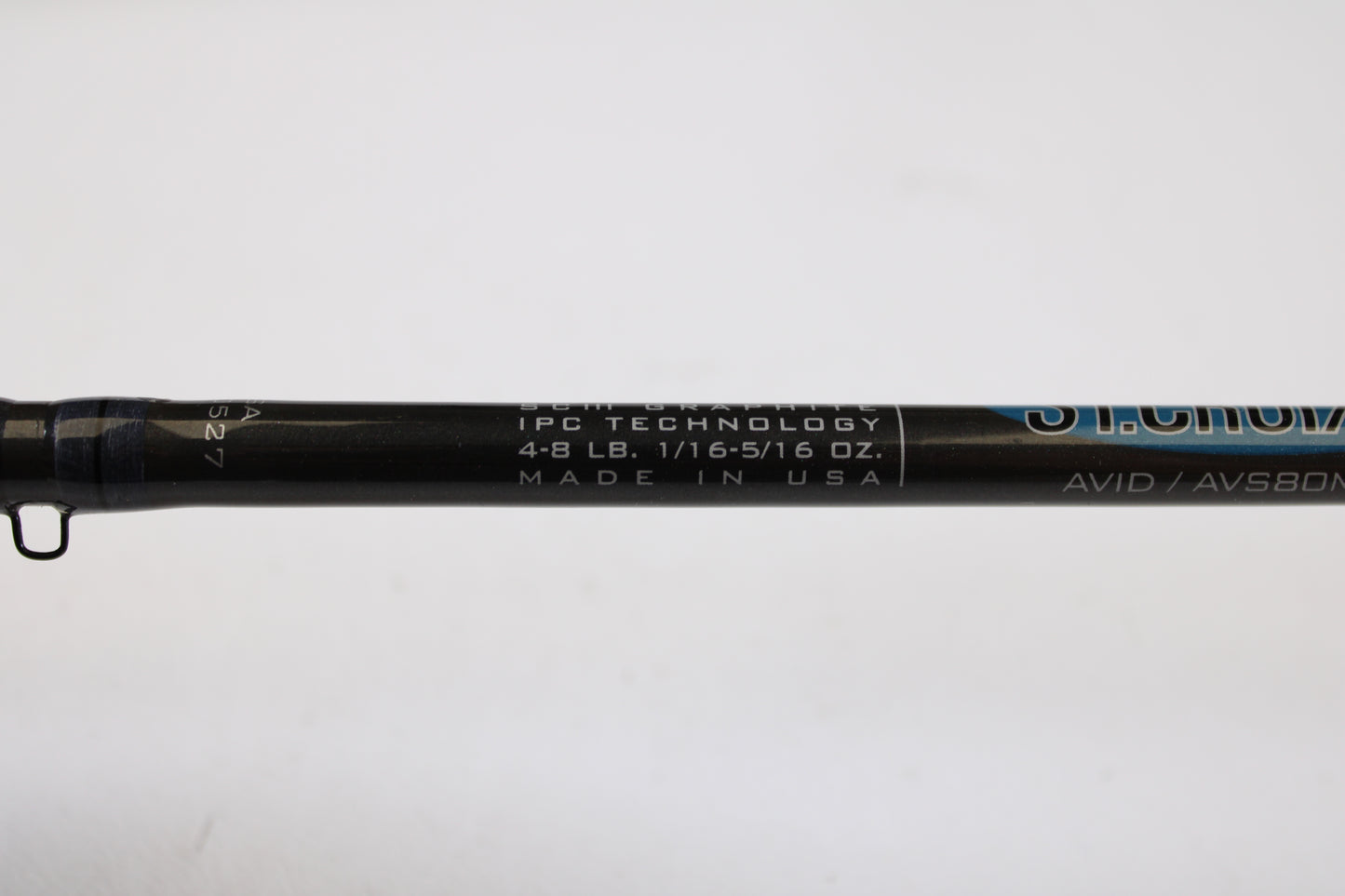 A close-up of a St. Croix Avid AVS80MLM2 8'0" Medium Light 2 Piece spinning rod (used, excellent), part of our Rod and Reel Trade-In Program, showing "IPC TECHNOLOGY, 4-8 LB, 1/16-5/16 OZ., MADE IN USA" on a white background.