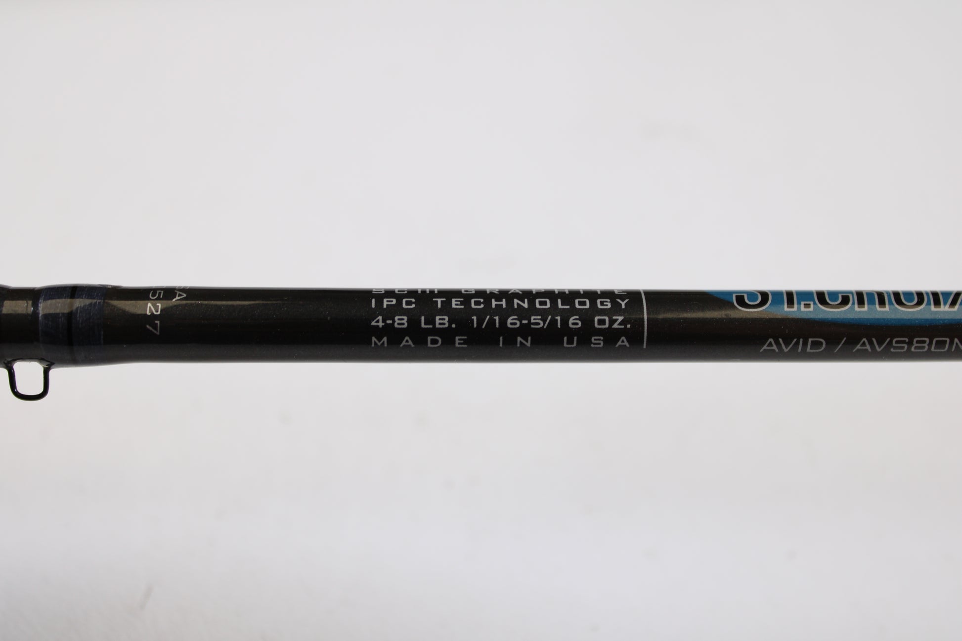 A close-up of a St. Croix Avid AVS80MLM2 8'0" Medium Light 2 Piece spinning rod (used, excellent), part of our Rod and Reel Trade-In Program, showing "IPC TECHNOLOGY, 4-8 LB, 1/16-5/16 OZ., MADE IN USA" on a white background.