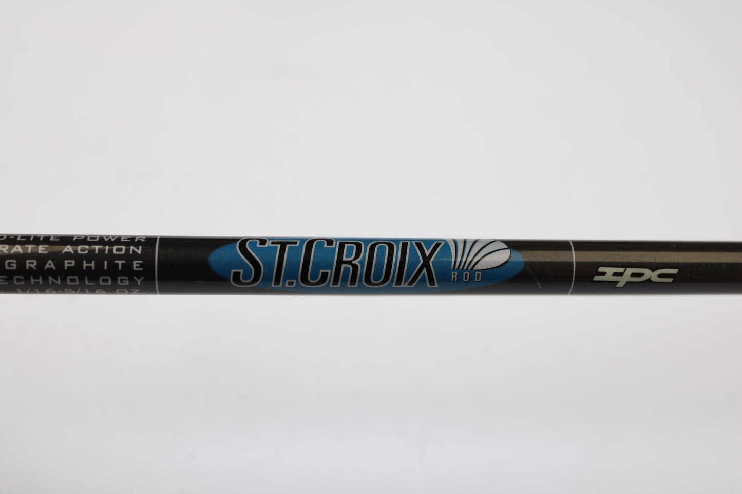 Close-up of a St. Croix Avid AVS80MLM2 8'0" Medium Light 2 Piece rod in excellent used condition, featuring the classic blue and white "ST. CROIX ROD" logo—a great choice for our Rod and Reel Trade-In Program.