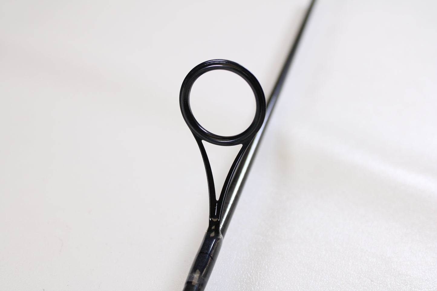 Close-up of the guide on a St. Croix Avid AVS80MLM2 8'0" Medium Light Used Spinning Rod in excellent condition. Ideal for anglers interested in our Rod and Reel Trade-In Program or seeking quality pre-owned St. Croix gear.