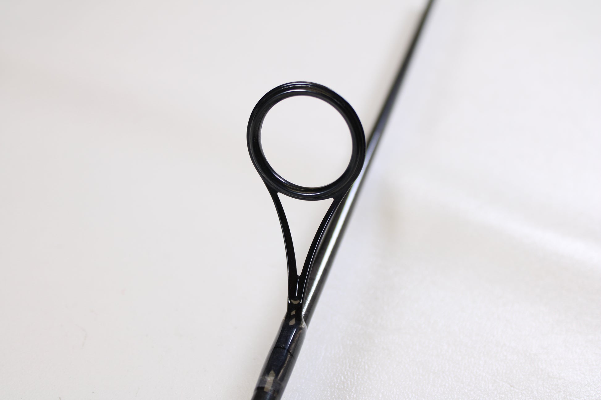 Close-up of the guide on a St. Croix Avid AVS80MLM2 8'0" Medium Light Used Spinning Rod in excellent condition. Ideal for anglers interested in our Rod and Reel Trade-In Program or seeking quality pre-owned St. Croix gear.