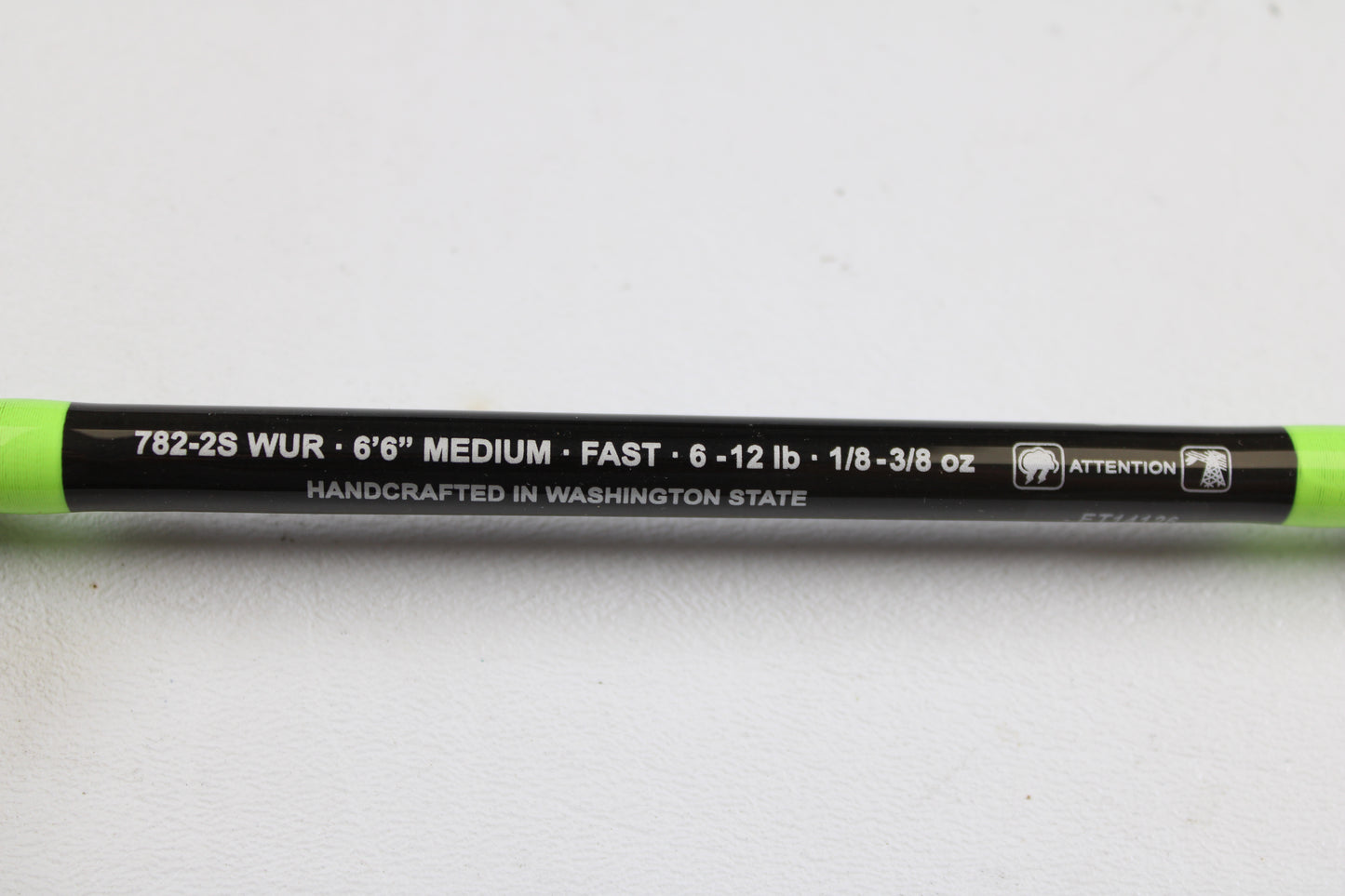 Close-up of a G. Loomis E6X Walleye 782-2S WUR, 6'6" medium, fast action, 2-piece used spinning rod in mint condition—handcrafted in Washington State. Ideal for used gear seekers or those using our trade-in program.