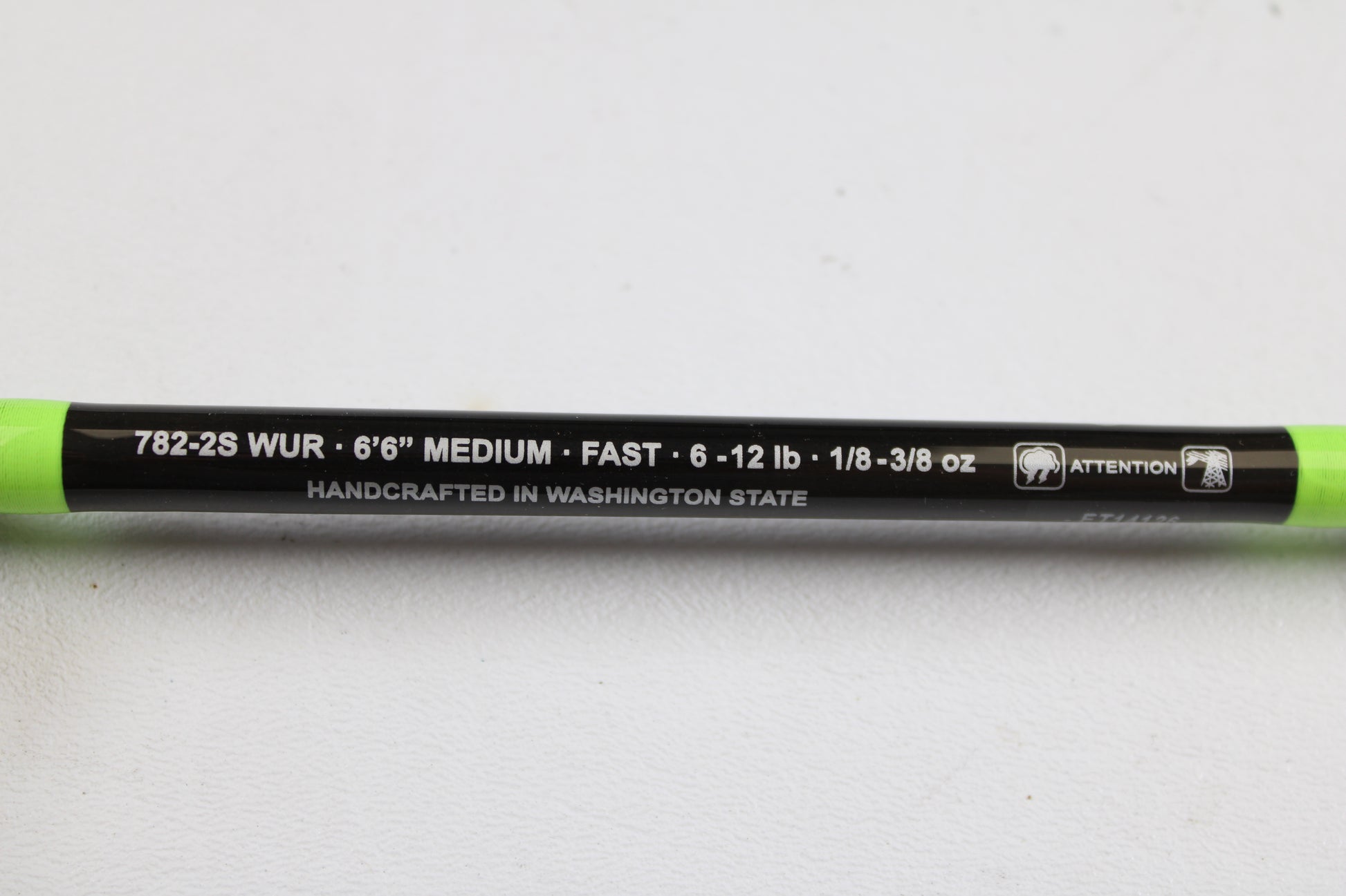 Close-up of a G. Loomis E6X Walleye 782-2S WUR, 6'6" medium, fast action, 2-piece used spinning rod in mint condition—handcrafted in Washington State. Ideal for used gear seekers or those using our trade-in program.