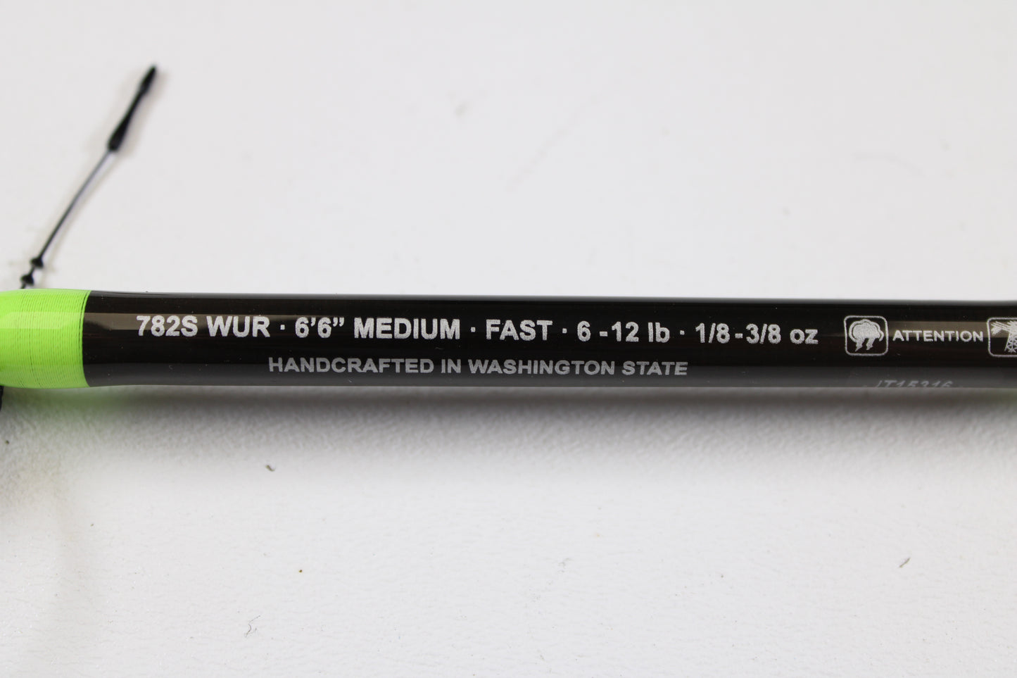 A close-up of the G. Loomis E6X Walleye 782S WUR 6’6” Medium Used Spinning Rod (Mint Condition) with specs and “HANDCRAFTED IN WASHINGTON STATE” on a white background—ideal for our rod and reel trade-in program.