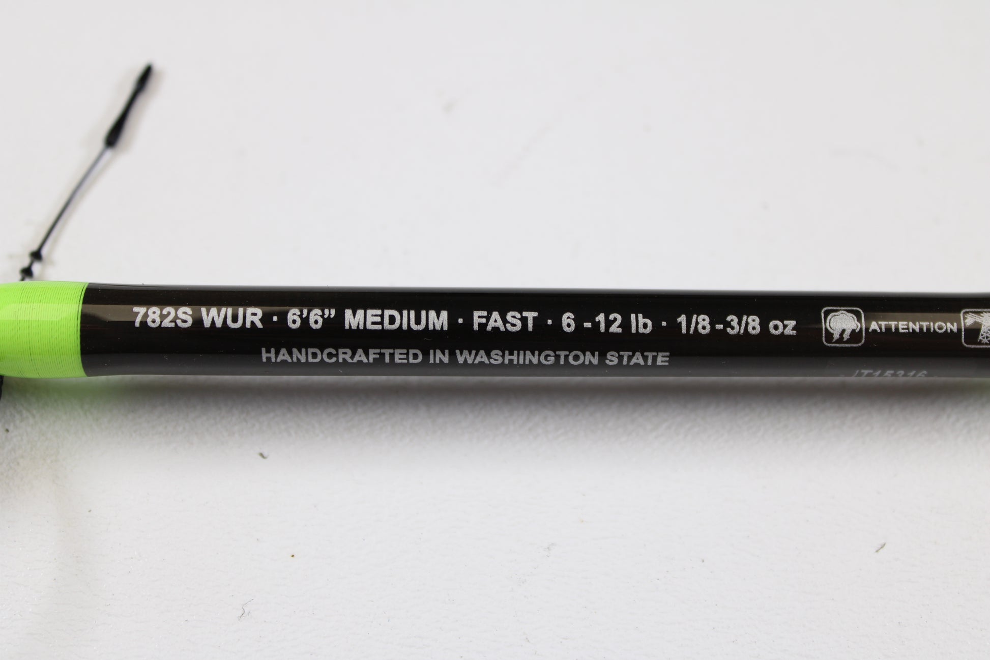 A close-up of the G. Loomis E6X Walleye 782S WUR 6’6” Medium Used Spinning Rod (Mint Condition) with specs and “HANDCRAFTED IN WASHINGTON STATE” on a white background—ideal for our rod and reel trade-in program.