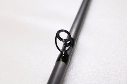 Close-up of the metallic guide ring on a G. Loomis E6X Steelhead 1021-2C HSR GH Used Casting Rod (Mint Condition), ideal for anglers seeking top quality used G. Loomis gear or participating in our rod and reel trade-in program.