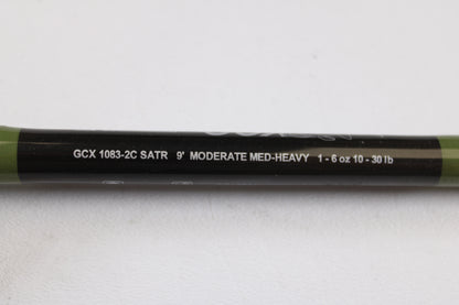 A close-up of a G. Loomis GCX Salmon 1083-2C SATR 9'0" Medium Heavy Used Casting Rod in mint condition. Ideal for shoppers interested in our rod and reel trade-in program or browsing top-quality used gear.