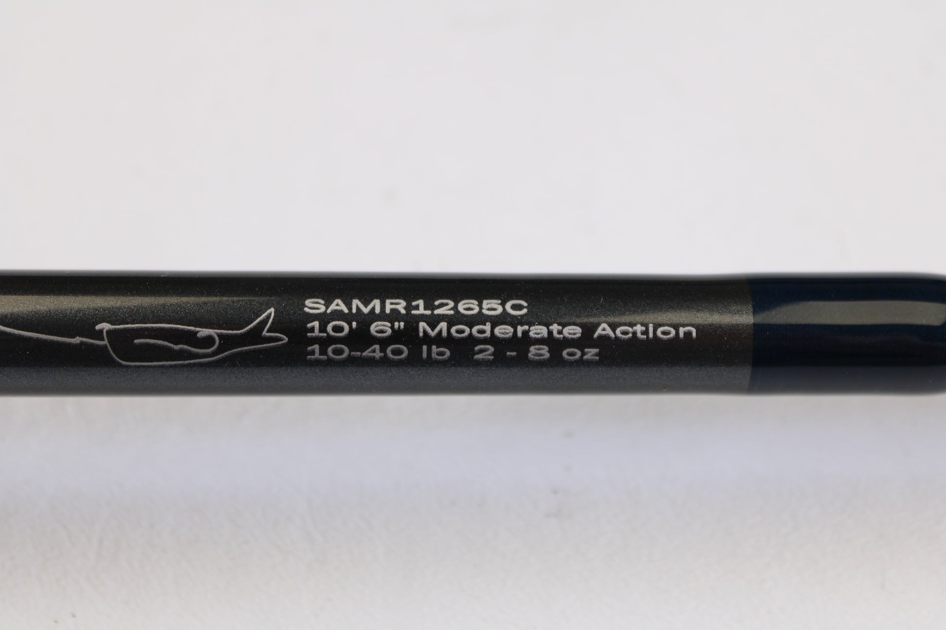 A close-up of the G. Loomis Salmon & Steelhead Mooching SAMR1265C 10'6" Heavy Casting Rod (used, mint) displays white model text, specs, and a fish hook graphic—ideal for our rod and reel trade-in program.