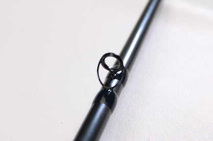 Close-up of a G. Loomis Salmon & Steelhead Mooching SAMR1265C 10'6" Heavy Used Casting Rod guide—ideal for anglers seeking a top-quality, mint condition upgrade for salmon and steelhead fishing.