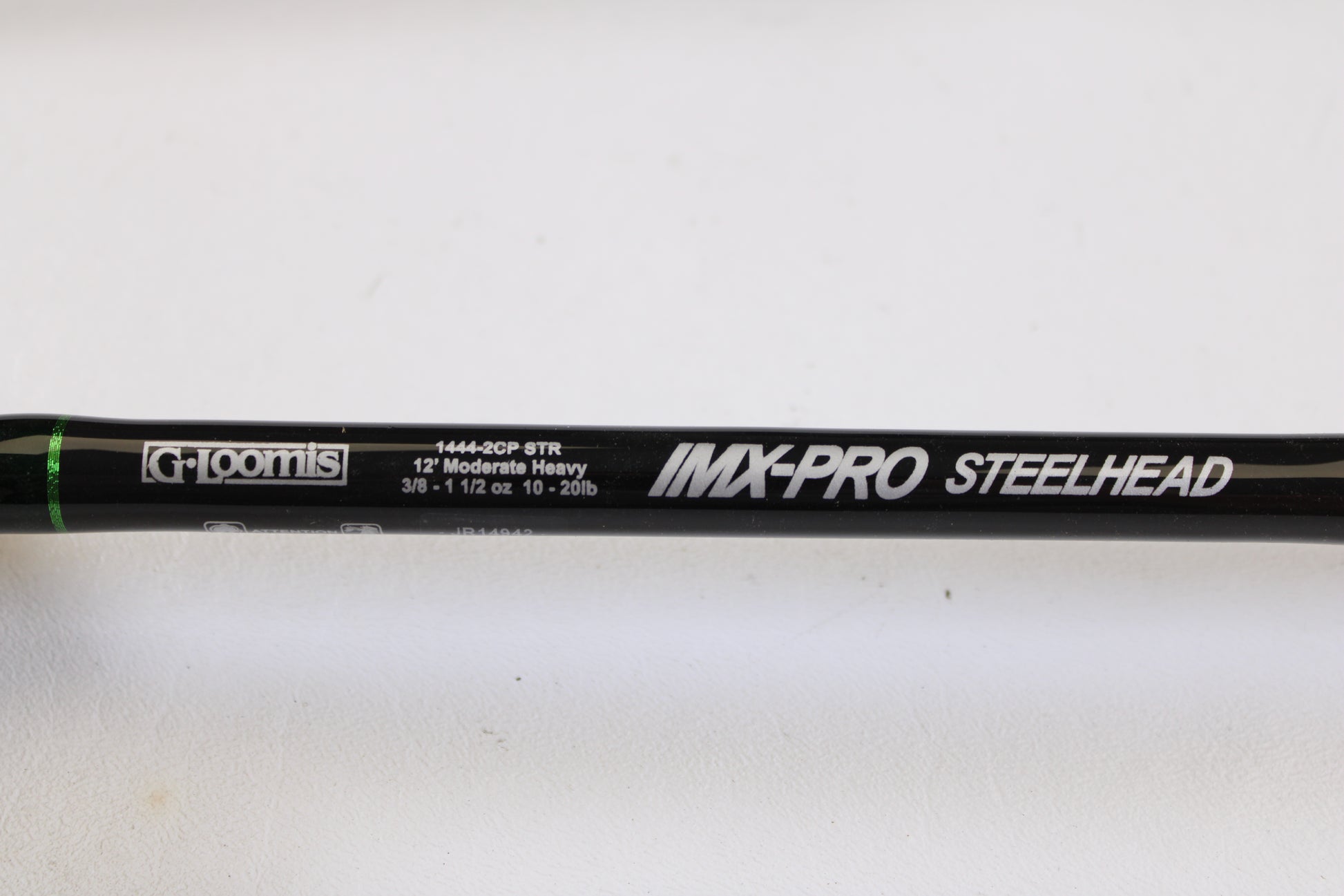 Close-up of a G. Loomis IMX-PRO Steelhead Centerpin 12'0" Heavy 2 Piece used spinning rod in mint condition—perfect for our Rod and Reel Trade-In Program: trade your used gear for store credit!.