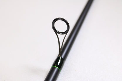 A close-up of the G. Loomis IMX-PRO Steelhead Centerpin 12'0" Heavy 2 Piece Used Spinning Rod in mint condition—ideal for anglers upgrading with our Trade-In Program or earning store credit on used G. Loomis gear.