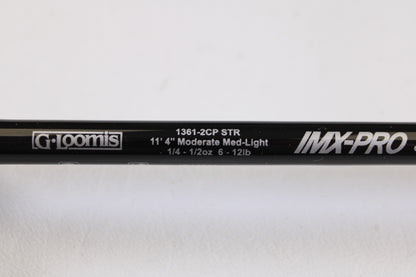 Close-up of a G. Loomis IMX-PRO Steelhead Centerpin 11'4" Medium Light 2 Piece Used Spinning Rod (Mint Condition) on a white background — ideal for our Rod and Reel Trade-In Program or to earn store credit on used gear.