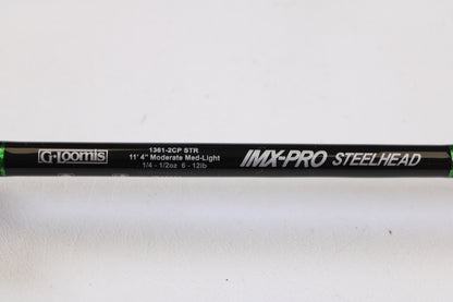 Close-up of a mint condition, used G. Loomis IMX-PRO Steelhead Centerpin 11'4" Medium Light 2-piece spinning rod—perfect for the Rod and Reel Trade-In Program to upgrade your gear and earn store credit.