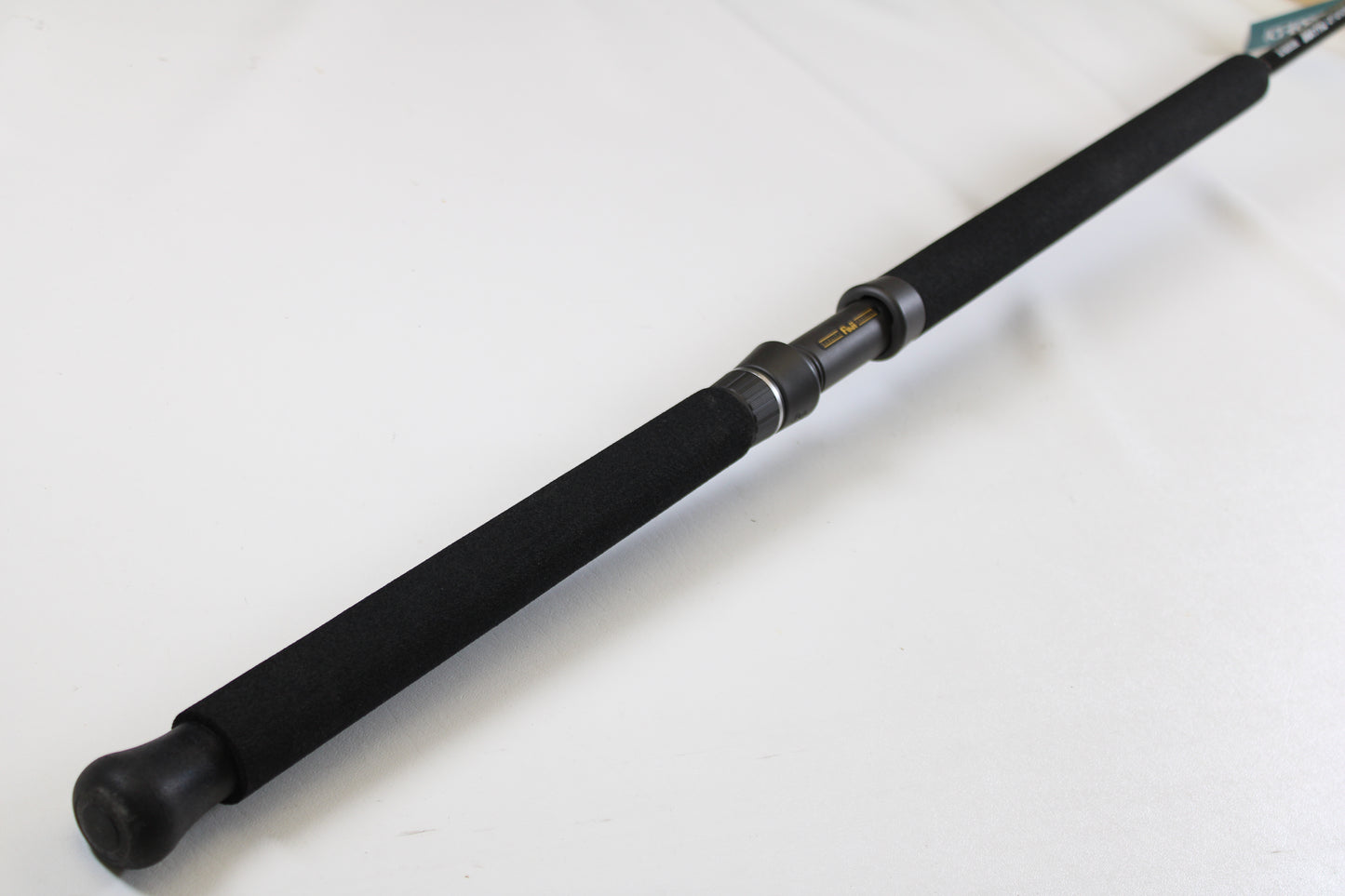 A close-up of the G. Loomis IMX-PRO Offshore 90-40 7'6" Medium Heavy Used Casting Rod in mint condition—ideal for upgrading with our rod and reel trade-in program or earning store credit for your used gear.