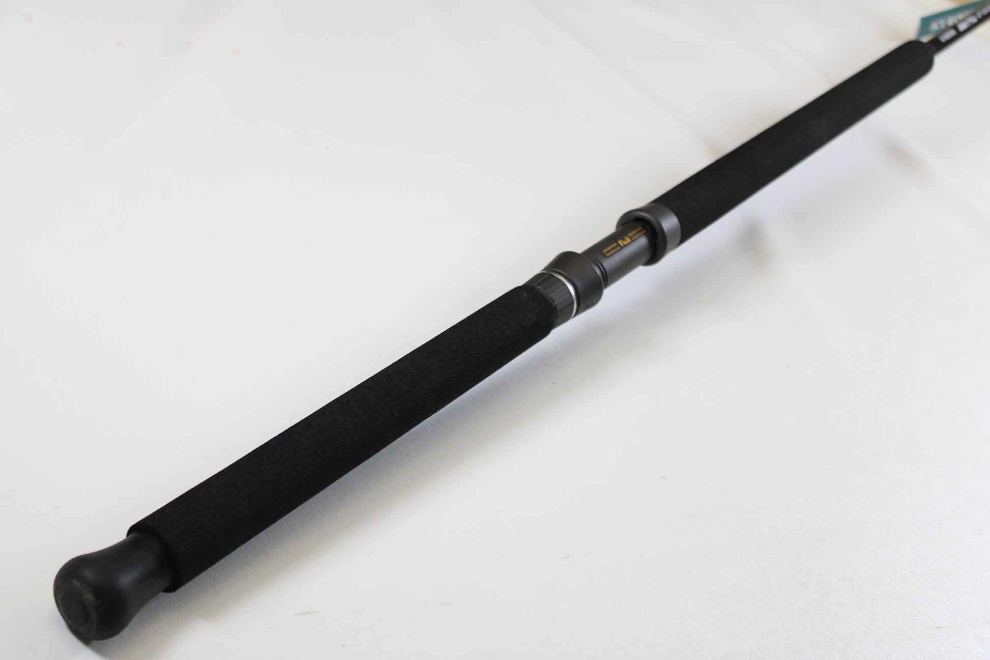 A close-up of the G. Loomis IMX-PRO Offshore 90-40 7'6" Medium Heavy Used Casting Rod in mint condition—ideal for upgrading with our rod and reel trade-in program or earning store credit for your used gear.