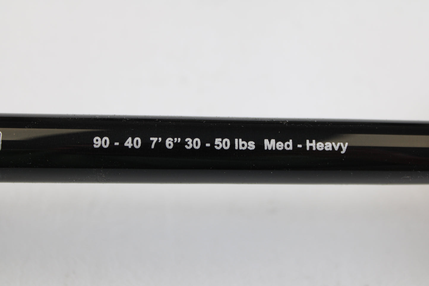 Close-up of a G. Loomis IMX-PRO Offshore 90-40 7'6" Medium Heavy Used Casting Rod in mint condition—ideal for our rod and reel trade-in program or to enhance your collection of quality pre-owned gear.