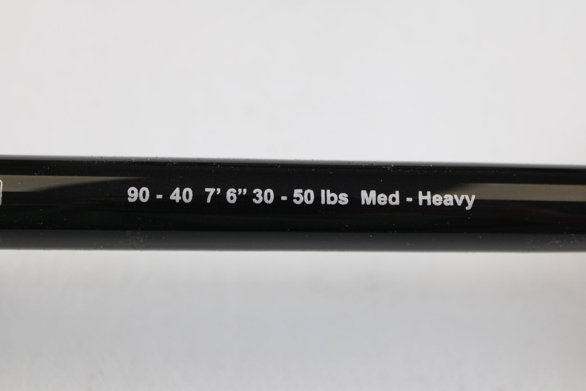 Close-up of a G. Loomis IMX-PRO Offshore 90-40 7'6" Medium Heavy Used Casting Rod in mint condition—ideal for our rod and reel trade-in program or to enhance your collection of quality pre-owned gear.