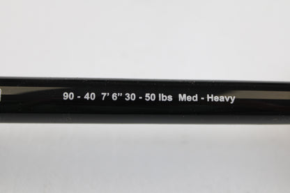 Close-up of a G. Loomis IMX-PRO Offshore 90-40 7'6" Medium Heavy Used Casting Rod in mint condition—ideal for our rod and reel trade-in program or to enhance your collection of quality pre-owned gear.