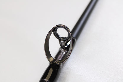 Close-up of the guide on a G. Loomis IMX-PRO Offshore 96-40 8'0" Medium Heavy Used Casting Rod in mint condition—ideal for anyone using our rod and reel trade-in program for store credit on used gear.