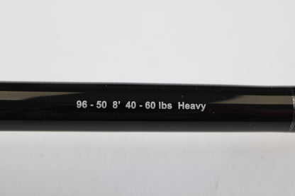Close-up of a G. Loomis IMX-PRO Offshore 96-50 8'0" Heavy Used Casting Rod in mint condition, featuring white printed specs—ideal for your next trade-in or to explore in our quality used gear collection.
