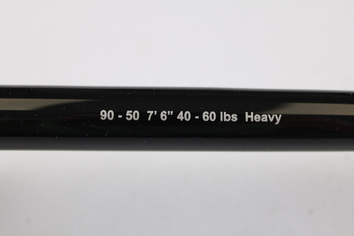 Close-up of a G. Loomis IMX-PRO Offshore 90-50 7'6" Heavy Used Casting Rod in mint condition. Trade in your used gear through our Rod and Reel Trade-In Program for store credit toward your next purchase.
