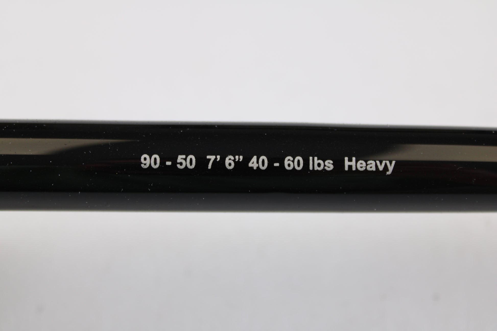 Close-up of a G. Loomis IMX-PRO Offshore 90-50 7'6" Heavy Used Casting Rod in mint condition. Trade in your used gear through our Rod and Reel Trade-In Program for store credit toward your next purchase.