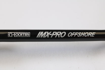 Close-up of a G. Loomis IMX-PRO Offshore 90-50 7'6" Heavy Used Casting Rod in mint condition—ideal for anglers interested in used gear or taking advantage of our Rod and Reel Trade-In Program for store credit.