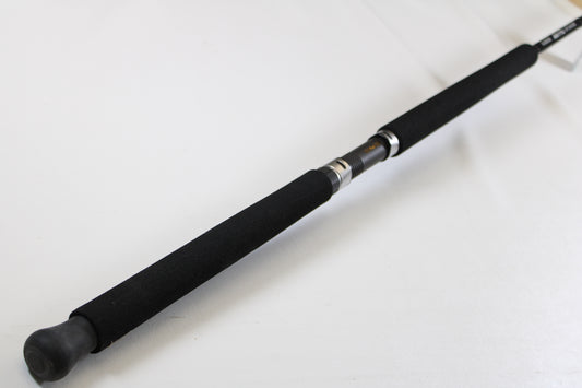 A close-up of the G. Loomis IMX-PRO Offshore 96-30 8'0" Medium Used Casting Rod (Mint Condition) handle against a white background—ideal for those looking to trade in used G. Loomis gear for store credit through our Trade-In Program.