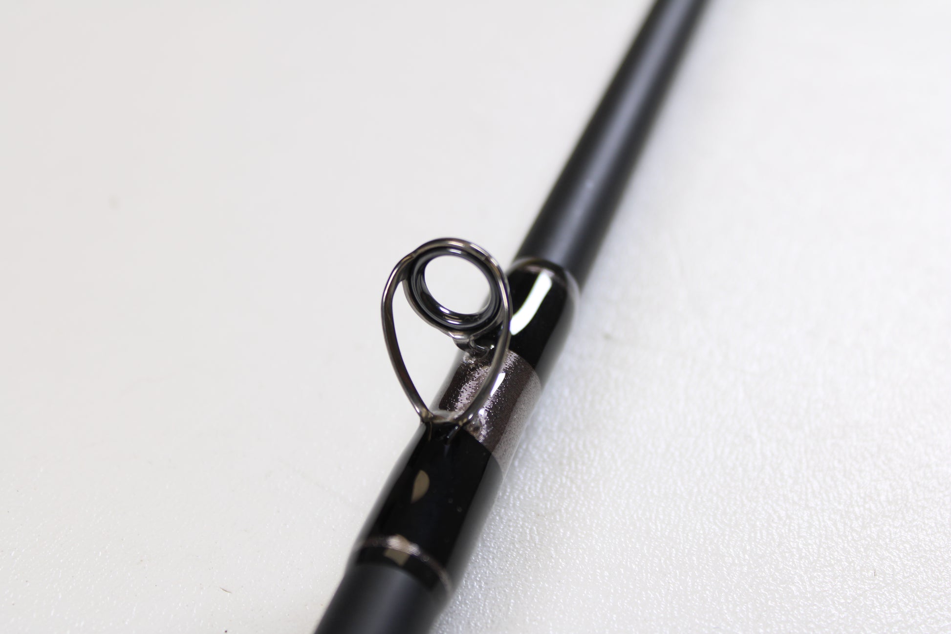 Close-up of the G. Loomis IMX-PRO Offshore 96-30 8'0" Medium Used Casting Rod in mint condition—ideal for anglers considering our Rod and Reel Trade-In Program.