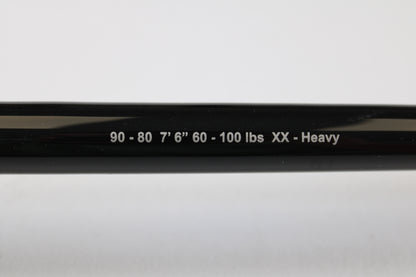 A close-up of a G. Loomis IMX-PRO Offshore 90-80 7'6" XXH Used Casting Rod, mint condition, from our used gear collection. Trade in your rod for store credit through our Rod and Reel Trade-In Program.