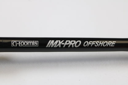 Close-up of a G. Loomis IMX-PRO Offshore 90-80 7'6" XXH Used Casting Rod in mint condition against a white background—eligible for our Rod and Reel Trade-In Program to earn store credit on used gear.