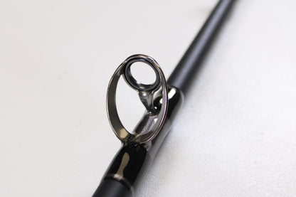 Close-up of the G. Loomis IMX-PRO Offshore 90-80 7'6" XXH—Used Casting Rod in mint condition, highlighting its glossy guide ring. Upgrade with our Rod and Reel Trade-In Program and get store credit for your used G. Loomis gear.