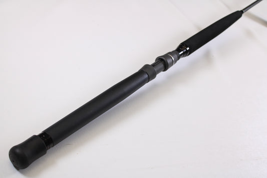 A close-up of the Shimano Terez BW TZBWC70MSBA 7'0" Medium Used Casting Rod’s black foam handle, shown in mint condition against a white background—ideal for our rod and reel trade-in program.