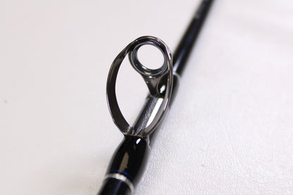 Close-up of the Shimano Terez BW TZBWC70MSBA 7'0" Medium Used Casting Rod's guide ring on a black rod, set against a white background. Mint condition—ideal for anyone seeking quality used Shimano gear.
