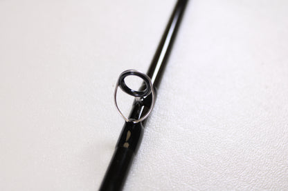 A close-up of a guide ring on the G. Loomis IMX-PRO V2 Fly Rod 490-4 9'0" #4, used but in mint condition—ideal for those interested in G. Loomis quality or our rod and reel trade-in program.