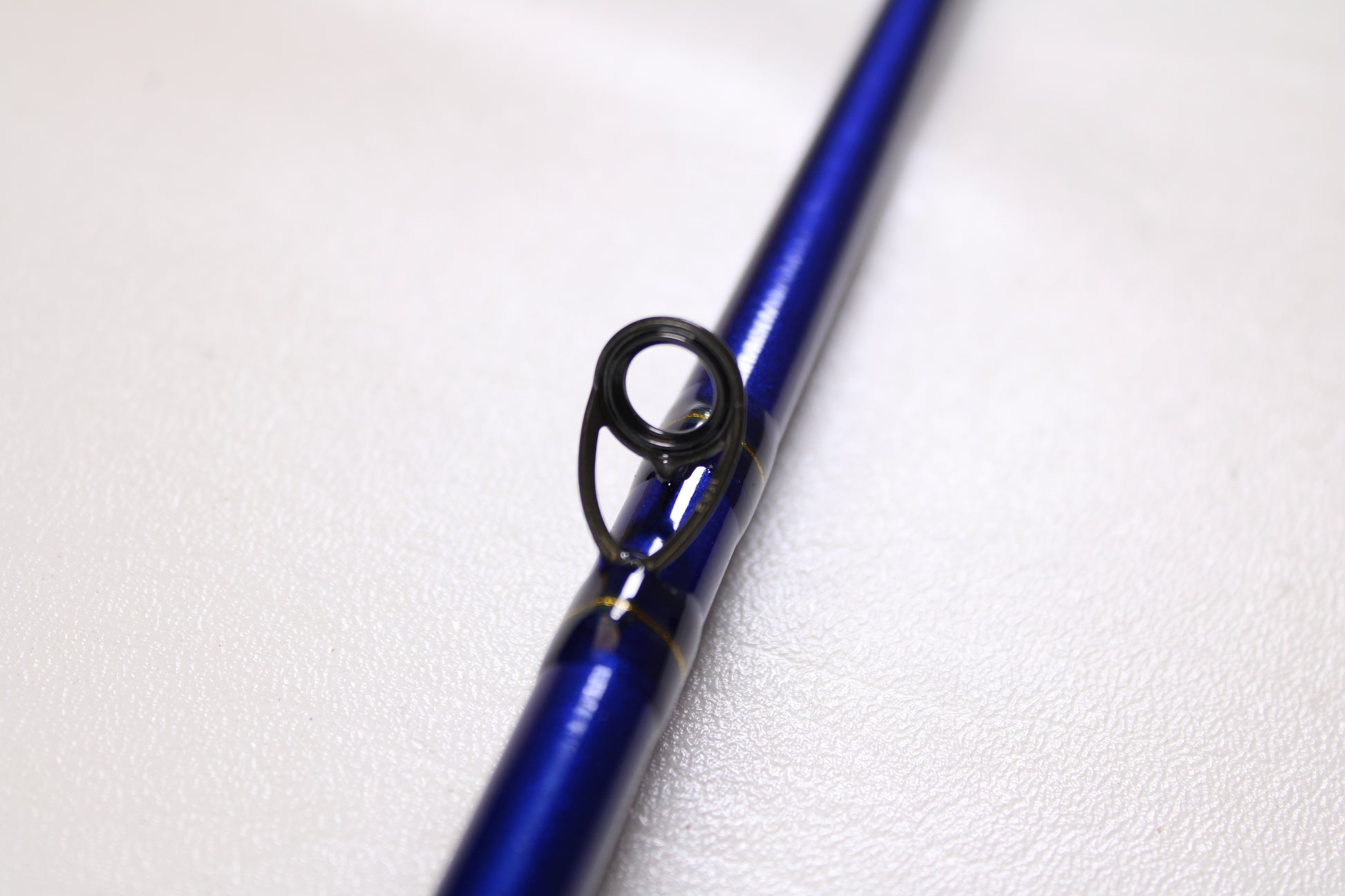 A close-up of the St. Croix Legend Tournament Pike LTPC223HF2 7'4" Heavy 2-Piece Used Casting Rod in mint condition, highlighting its metal line guide—ideal for those seeking to upgrade their gear or explore our rod and reel trade-in program.