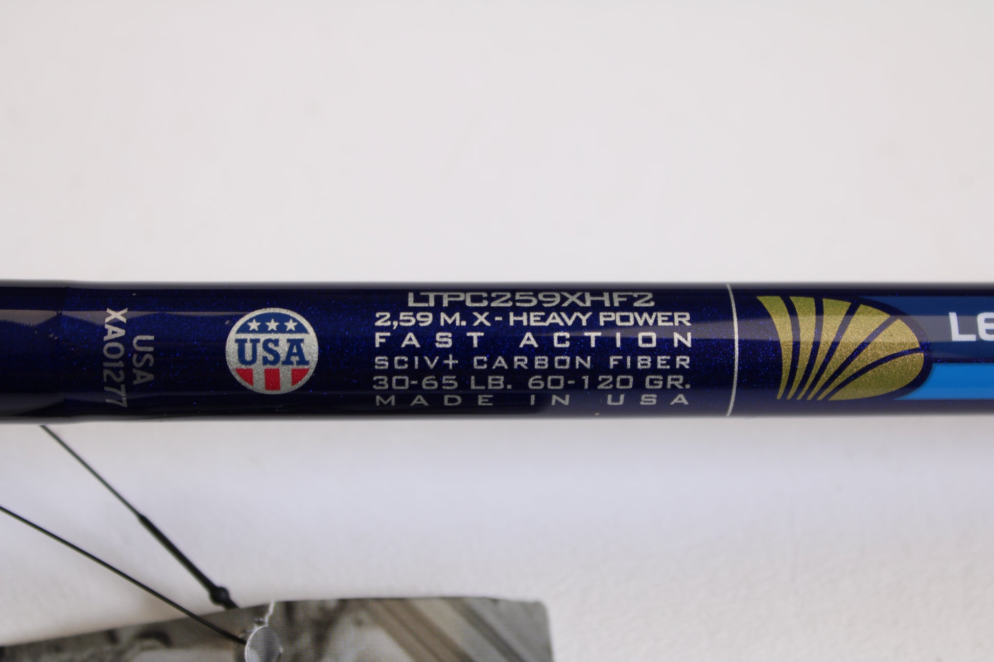 Close-up of a St. Croix Legend Tournament Pike LTPC259XHF2 Big Shad Swimbait 8'6" XH casting rod label: "2.59m, X-Heavy, Fast Action, SCIV+ Carbon Fiber, 30-65lb, 60-120gr." USA flag emblem, “Made in USA.” Eligible for Rod & Reel Trade-In Program.