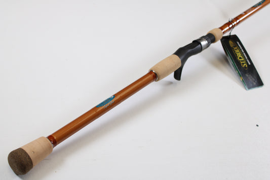 A close-up of a St. Croix Legend Glass LGC88HM 8'8" Heavy used casting rod in mint condition, featuring cork handles and a black reel seat—ideal for our rod and reel trade-in program.