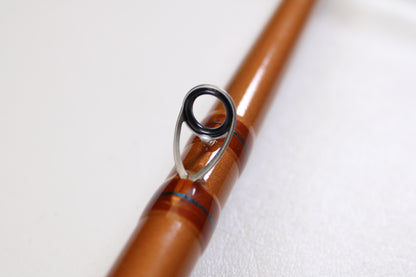 Close-up of a St. Croix Legend Glass LGC88HM 8'8" Heavy used casting rod in mint condition, featuring a metal line guide, against a white background—ideal for upgrading with our rod and reel trade-in program for store credit.