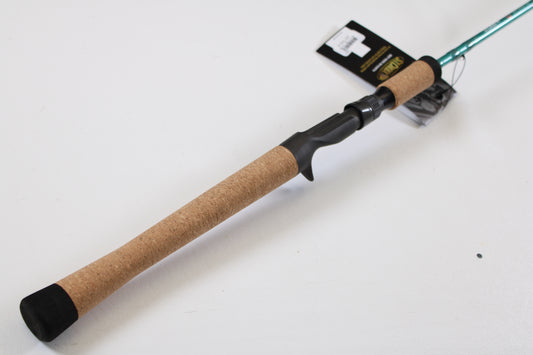 A close-up of the St. Croix Avid Inshore ASIC70MLM 7'0" Medium Light casting rod’s cork handle, black reel seat, and attached tag on a white background—ideal for those trading in used gear with our Rod and Reel Trade-In Program.