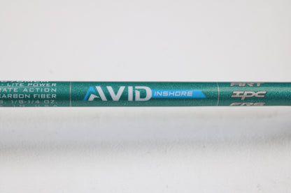 A close-up of the St. Croix Avid Inshore ASIC70MLM 7'0" Medium Light Used Casting Rod in mint condition. "AVID INSHORE" appears in white and blue on the green rod, shown against a plain white background—ideal for trade-in or used gear seekers.