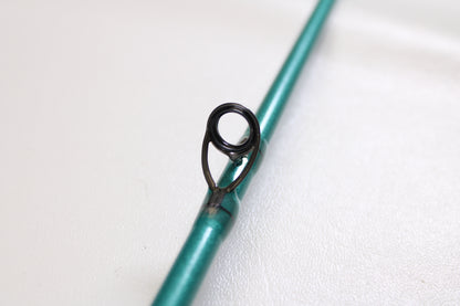 Close-up of a St. Croix Avid Inshore ASIC70MLM 7'0" Medium Light Used Casting Rod in mint condition, highlighting a black metal line guide—ideal for those interested in our Rod and Reel Trade-In Program for store credit.